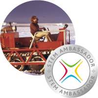 A picture of Steve Wroe on a snow vehicle. The STEM Ambassador logo